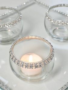 Classic elegance. Use simple tea light votive and a rhinestone ribbon on the edges. For the glass "plate" use a picture frame glass and glue the matching ribbon around the edges. No tutorial. 